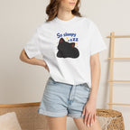 Black cat print T-shirt from Printify featuring a sleep-themed design on a comfortable black fabric.