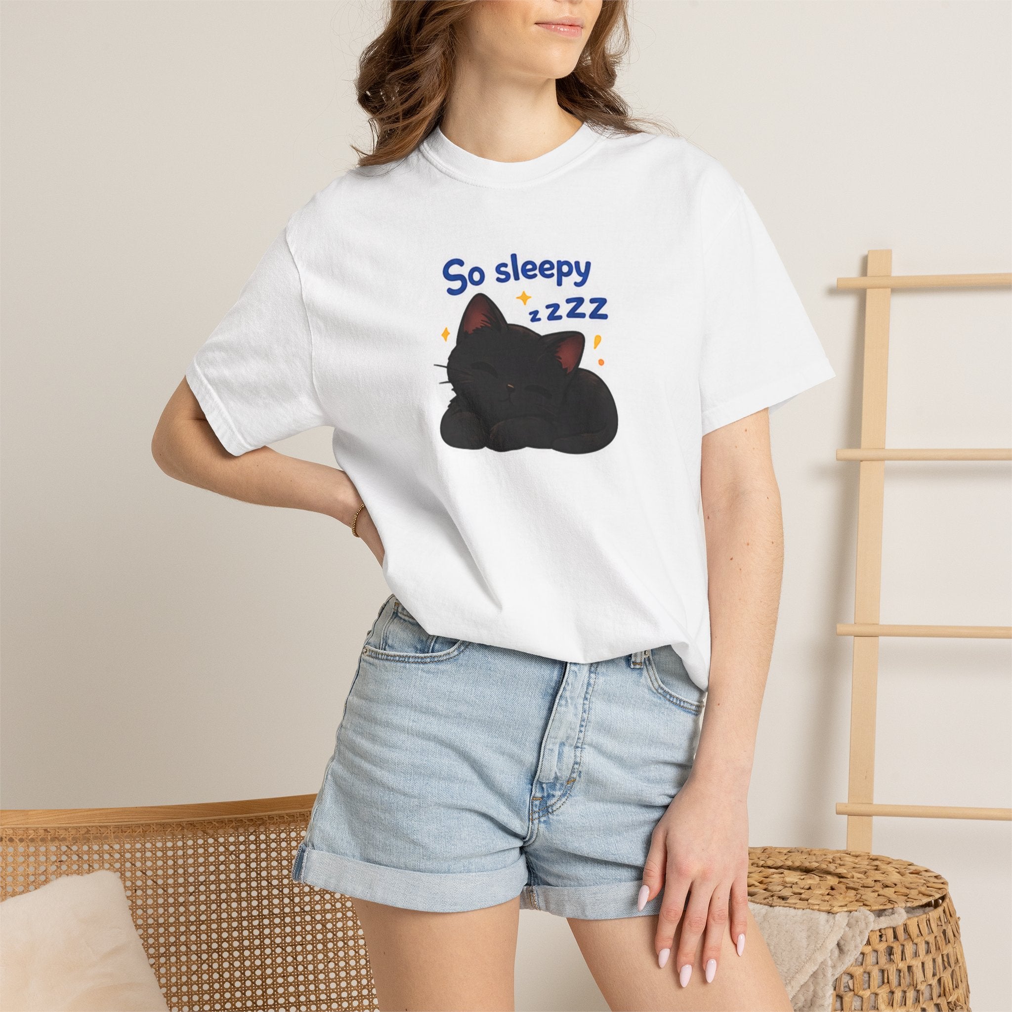 Black cat print T-shirt from Printify featuring a sleep-themed design on a comfortable black fabric.