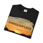 White Printify T-shirt with the phrase "We love the things we love for what they are" printed in black text.