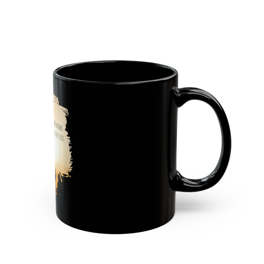 Black ceramic mug with the quote "A friend is someone who knows all about you and still loves you" printed in white text.