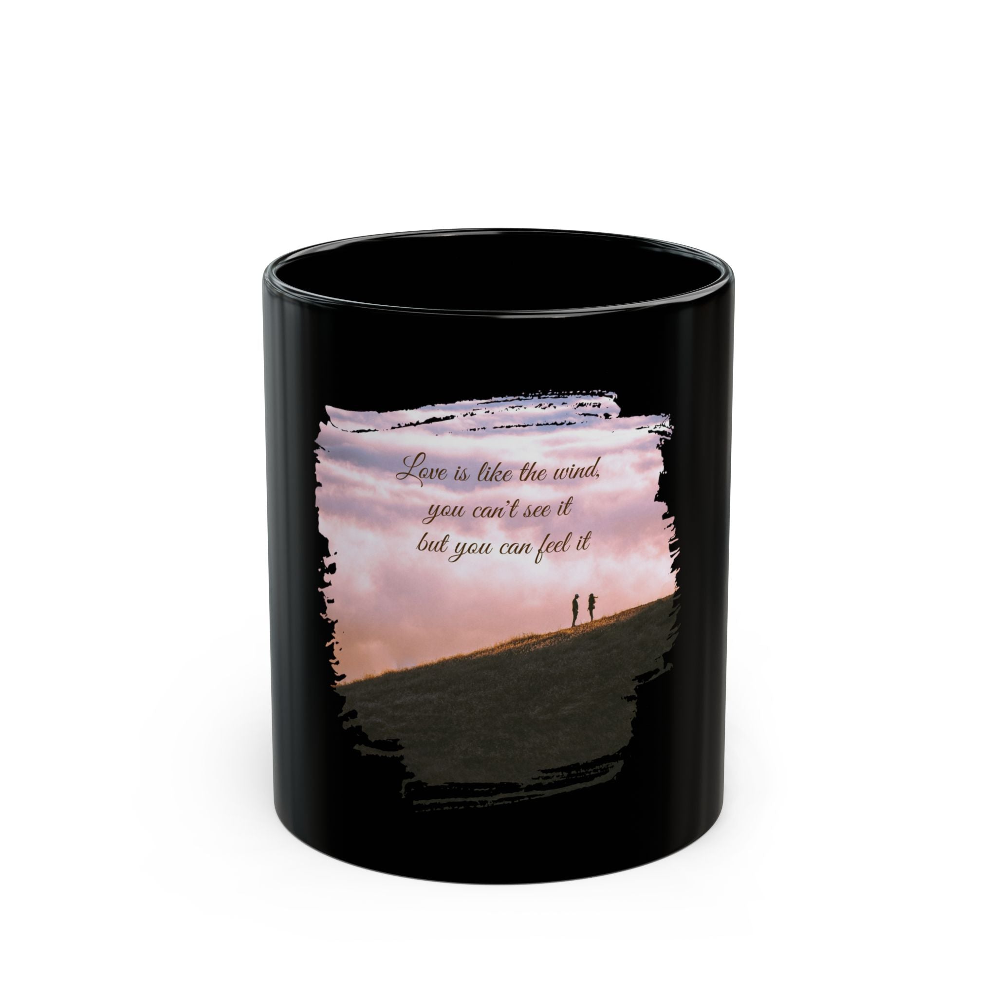Black ceramic mug with the quote "Love is like the wind, you can't see it but you can feel it" printed in white text.