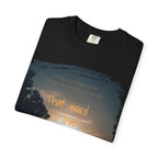 White Printify T-shirt with the quote "One word frees us of all the weight and pain of life. That word is Love" printed on the front.