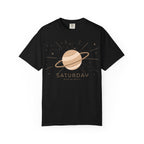 Black Saturday ruled by Saturn T-shirt by Printify, featuring celestial Saturn graphic on soft cotton fabric.