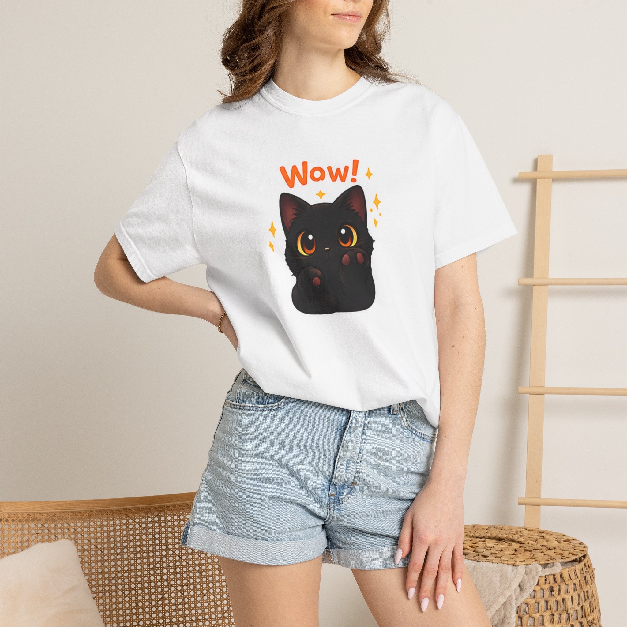 Black cat T-shirt by Printify featuring a cute cat design on a comfortable black cotton fabric.